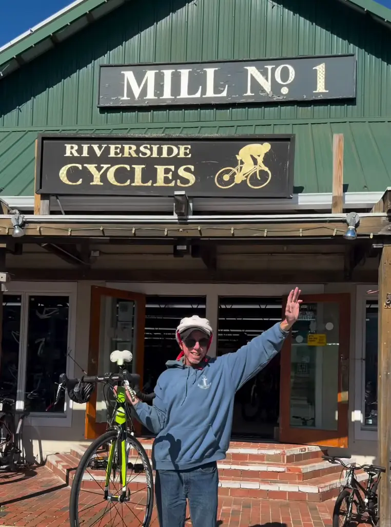 Brian outside Riverside Cycles with his new bicycle