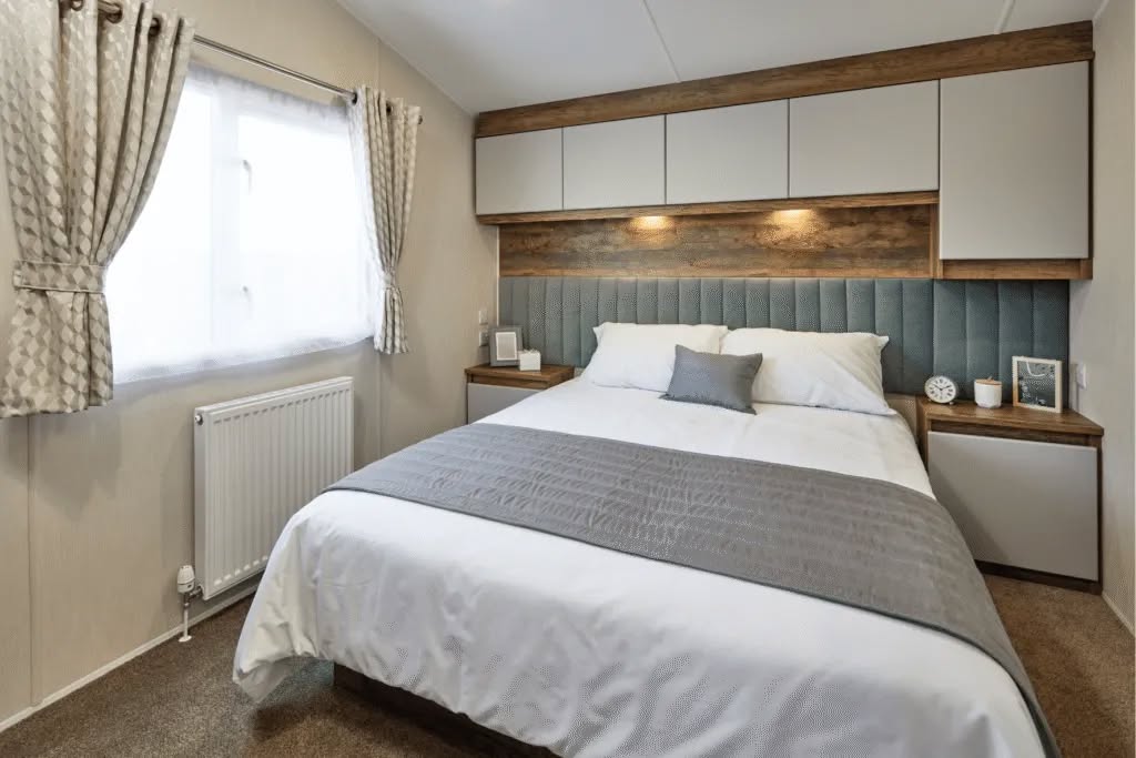 Stylishly designed master bedroom with warm feature lighting