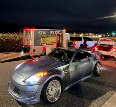 Nissan Z widebody getting mobile tire service at night - On Site Mobile Tire Service