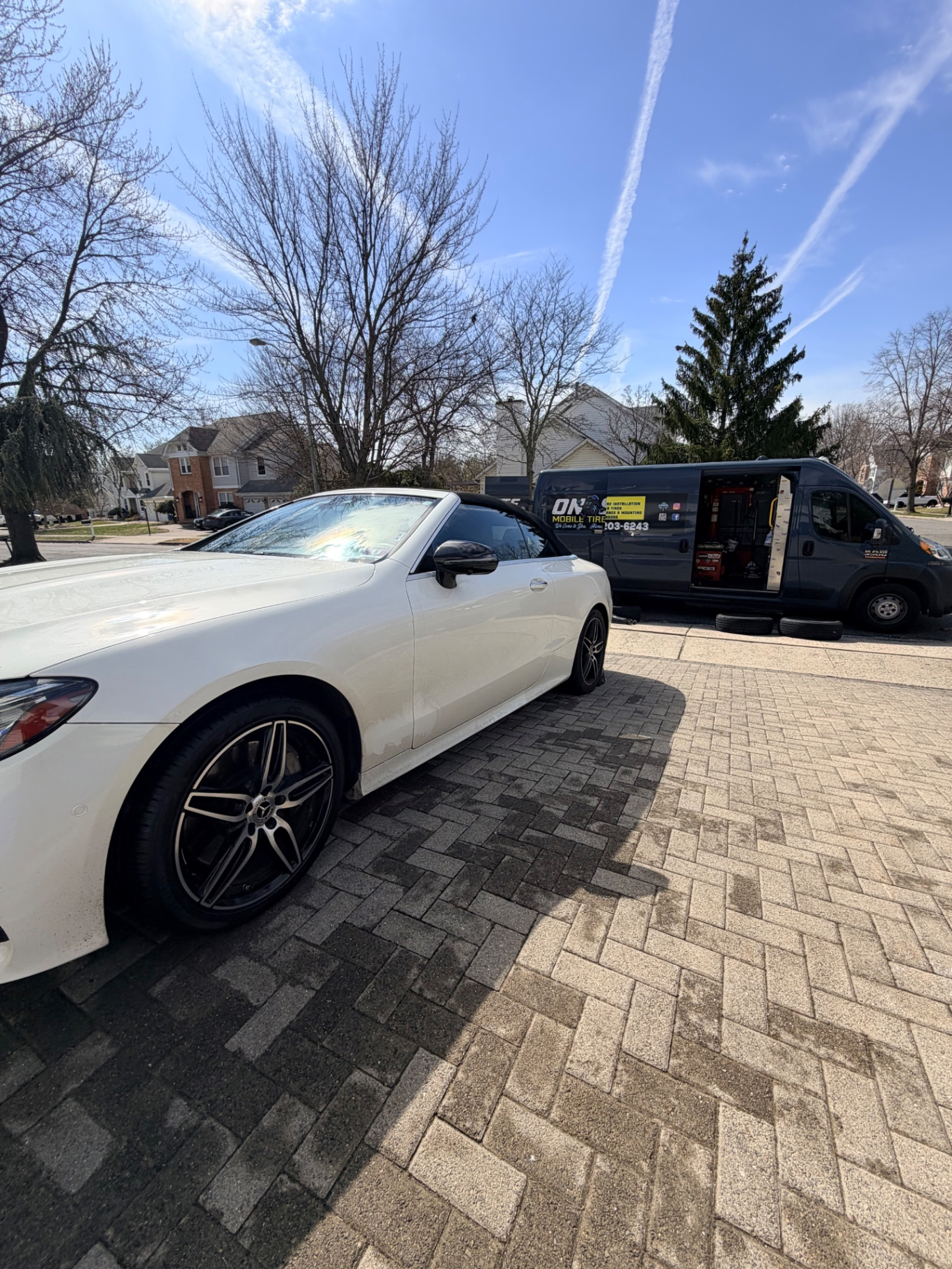 Mercedes C-Class Cabrio getting mobile tire service during a driveway visit - On Site Mobile Tire Service