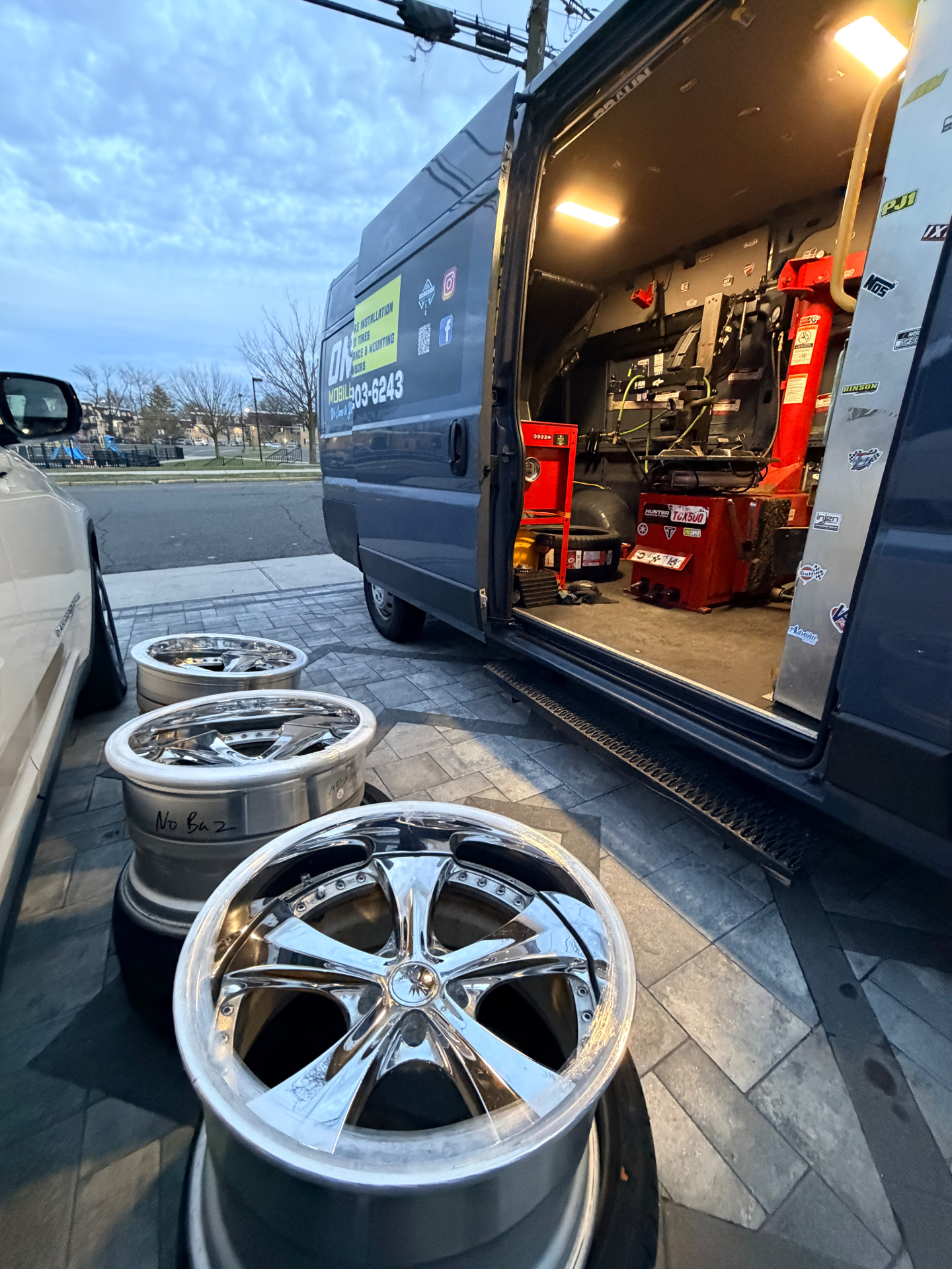 Custom chrome wheels getting mount & balance mobile tire service - On Site Mobile Tire Service