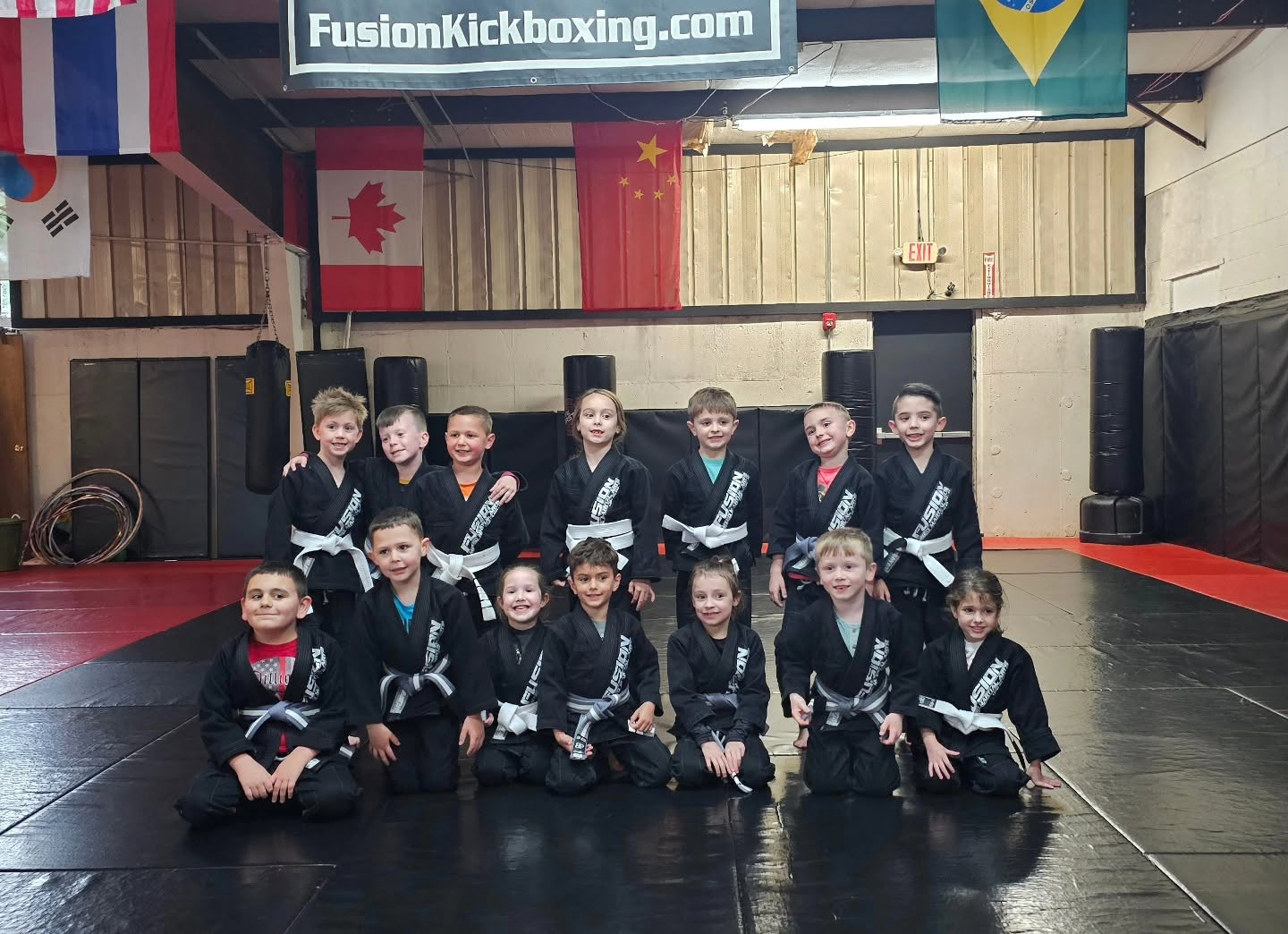 Fusion Kids Jiu-Jitsu team on the mats in Port Jefferson Station