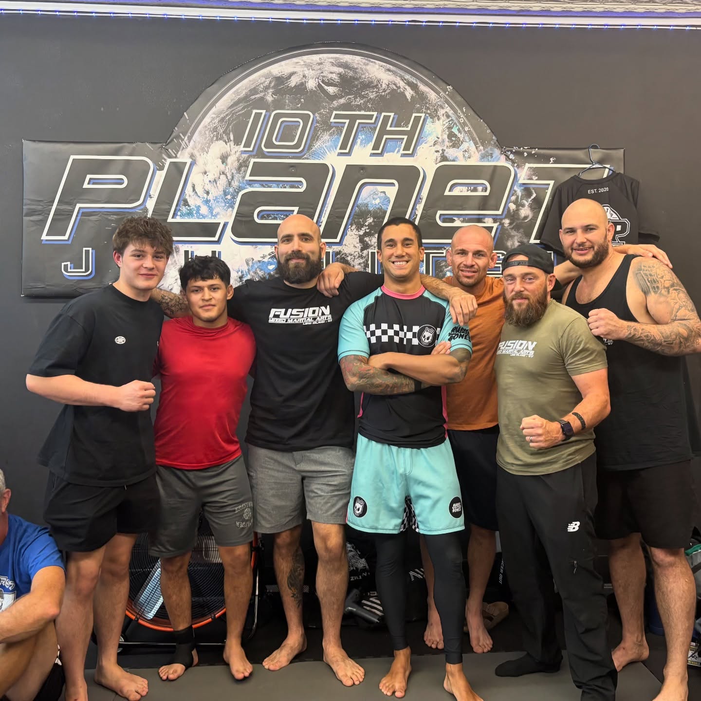 Coach Joe Funaro and Fusion Jiu-Jitsu team members on the mats