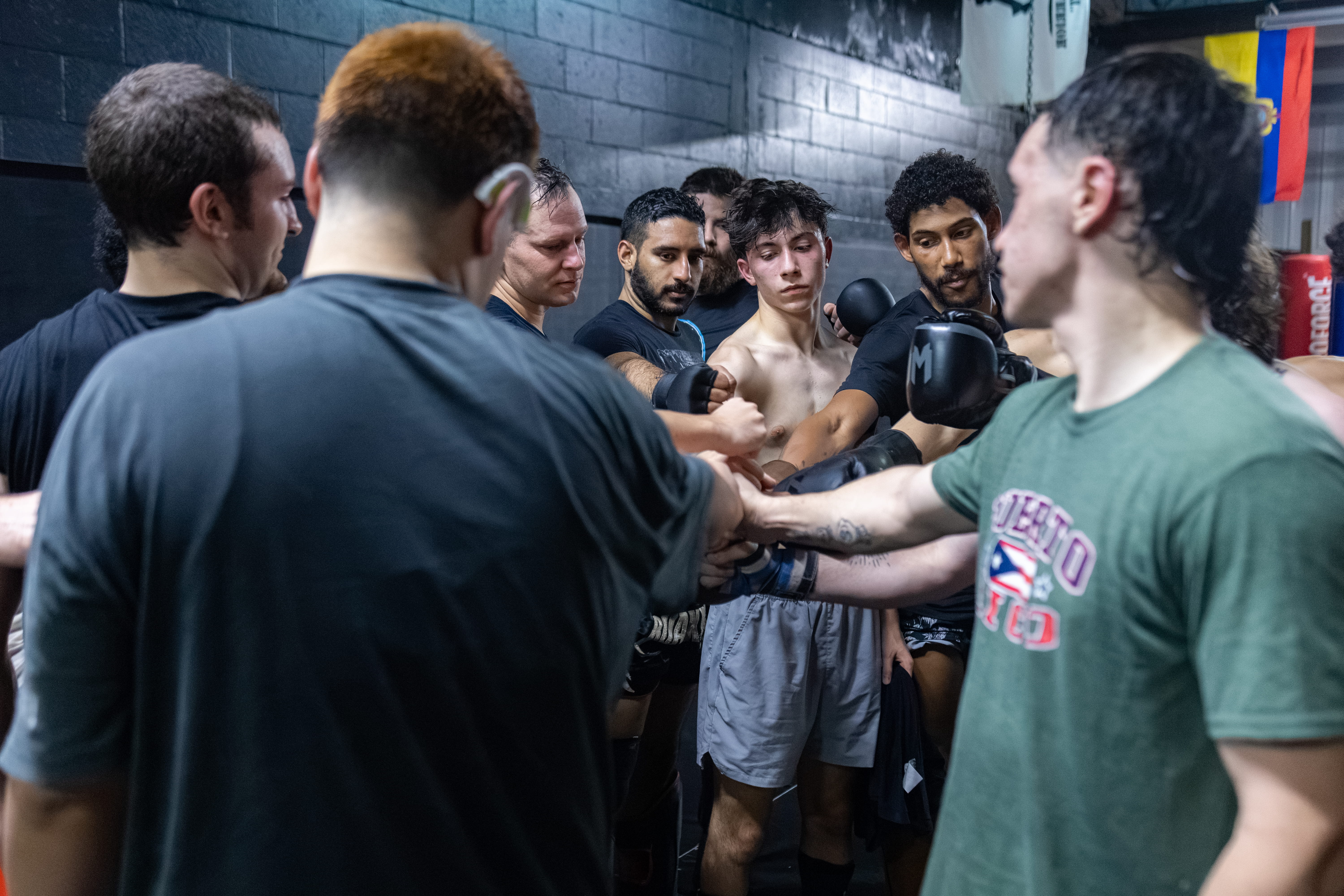 Fusion Muay Thai team huddle and supportive community
