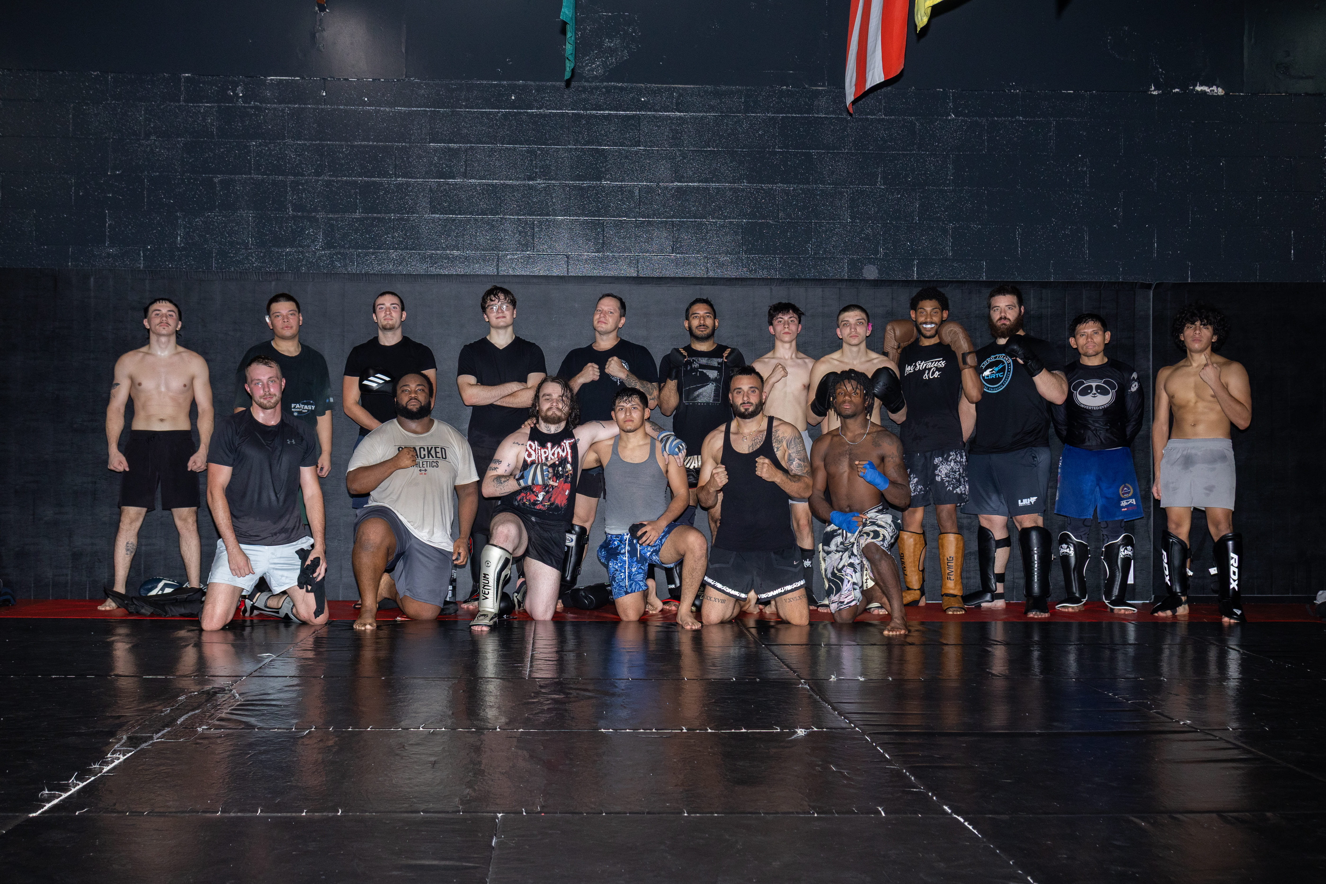 Fusion Muay Thai team and students lined up on the mats in Port Jefferson Station