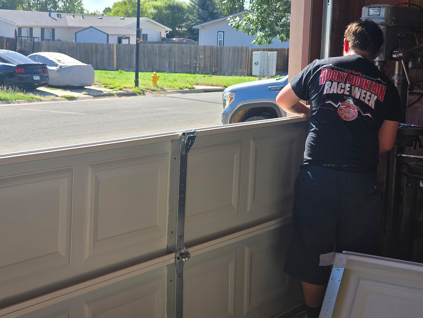 Garage door panel installation and alignment work by Timeless Entry Garage Doors
