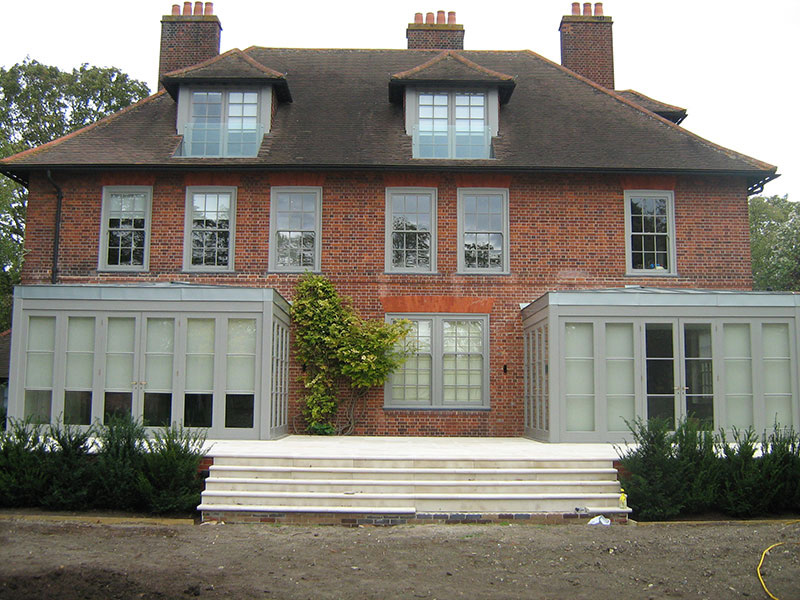 Salmons Brothers red brick estate with handcrafted timber bay windows and stone terrace