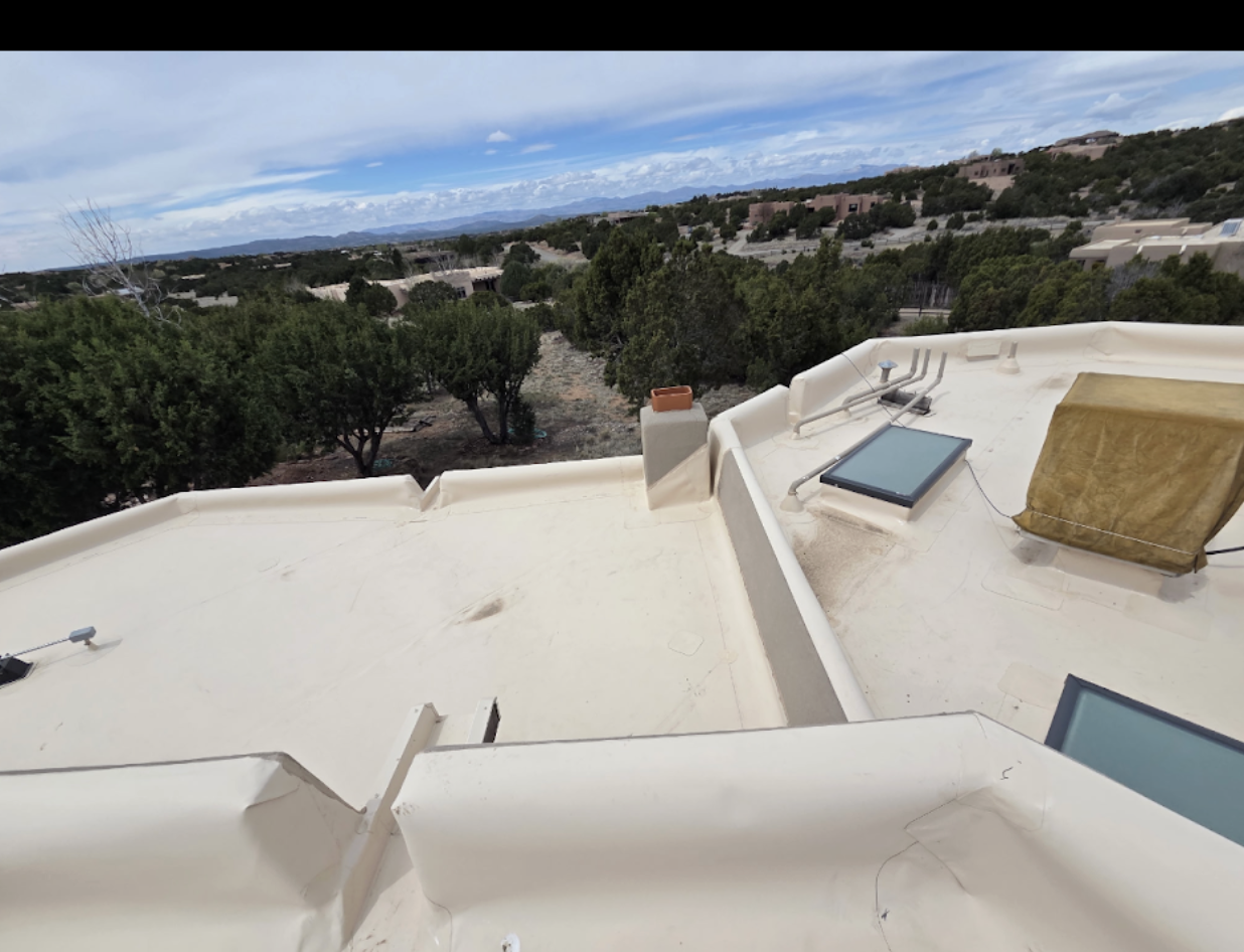 Southwest Pueblo Flat Roof Membrane completed by Confidence Roofing LLC