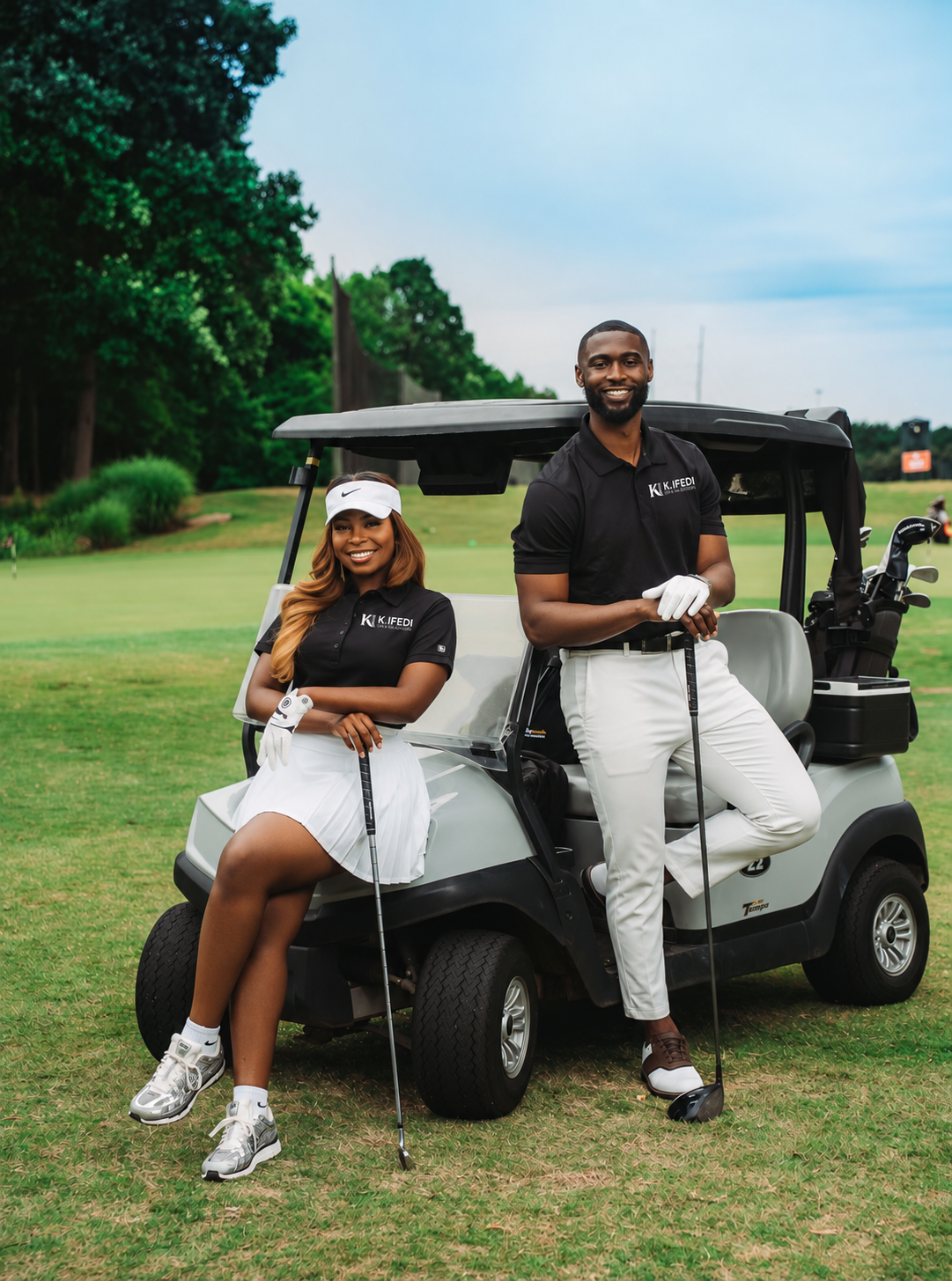 Seyi and Kingsley Ifedi on the golf course with a golf cart — your hosts for Dental Wealth Weekend