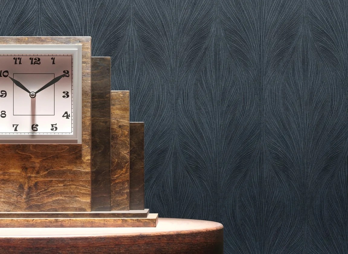 Art Deco stepped wooden clock against a dark textured feather relief wallcovering