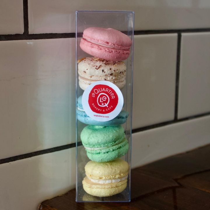 Assortment of colorful French macarons at Le Quartier