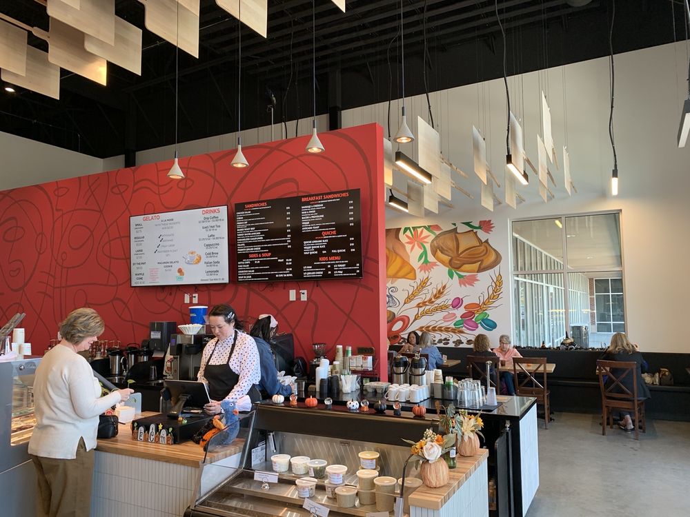 Inside Le Quartier Bakery cafe counter and dining room