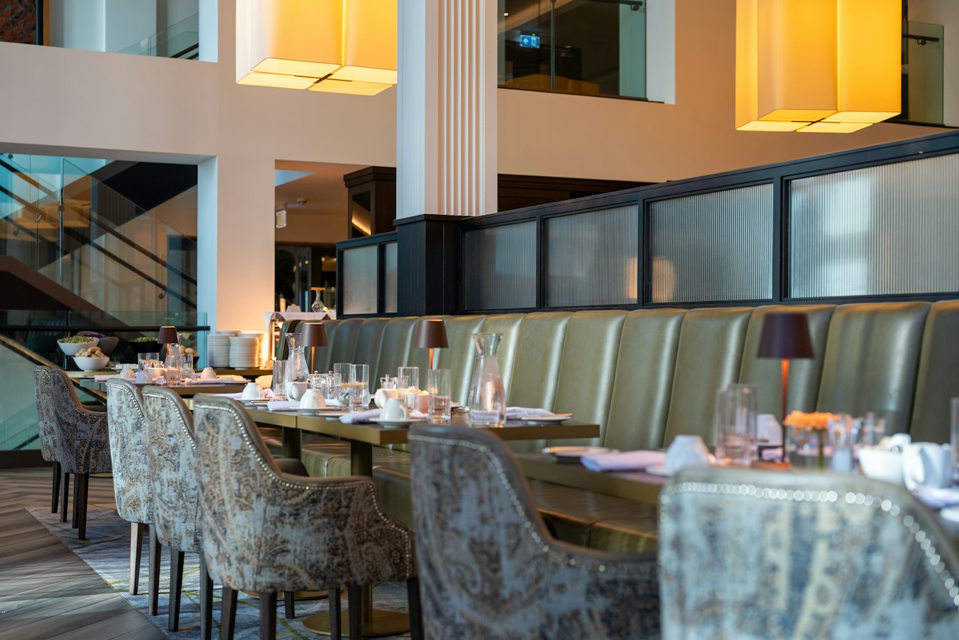An upscale full-service restaurant dining room set for service