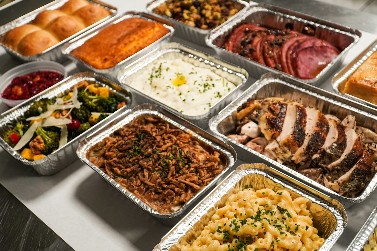 Catering trays of entrées and sides ready for an office order