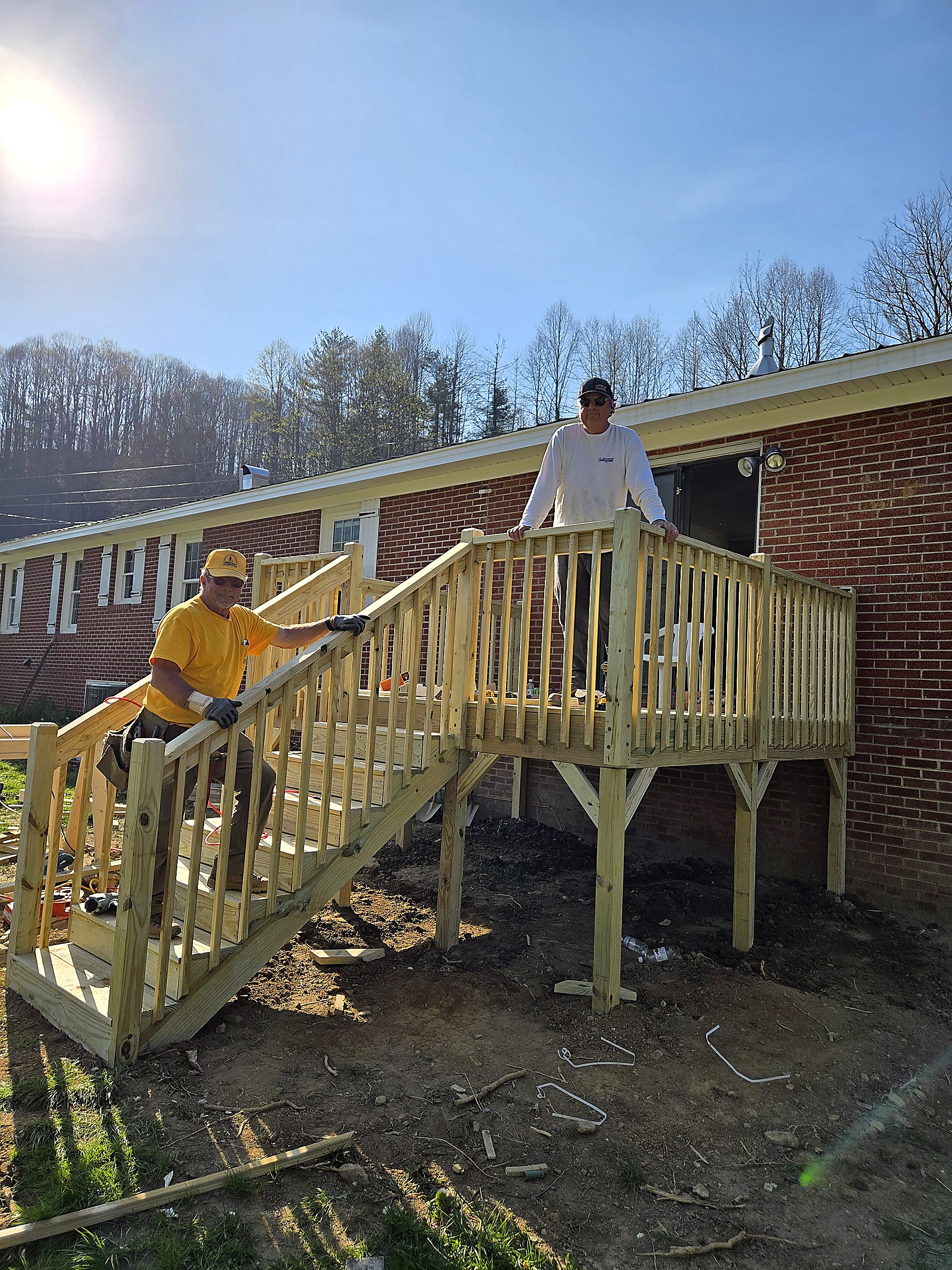 Tucker Built Construction crew finishing a new deck and stairs