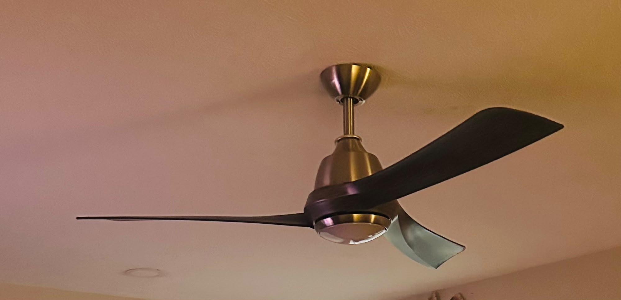 Modern brushed nickel 3-blade ceiling fan installation with LED light kit by Anaeli GM Electric LLC