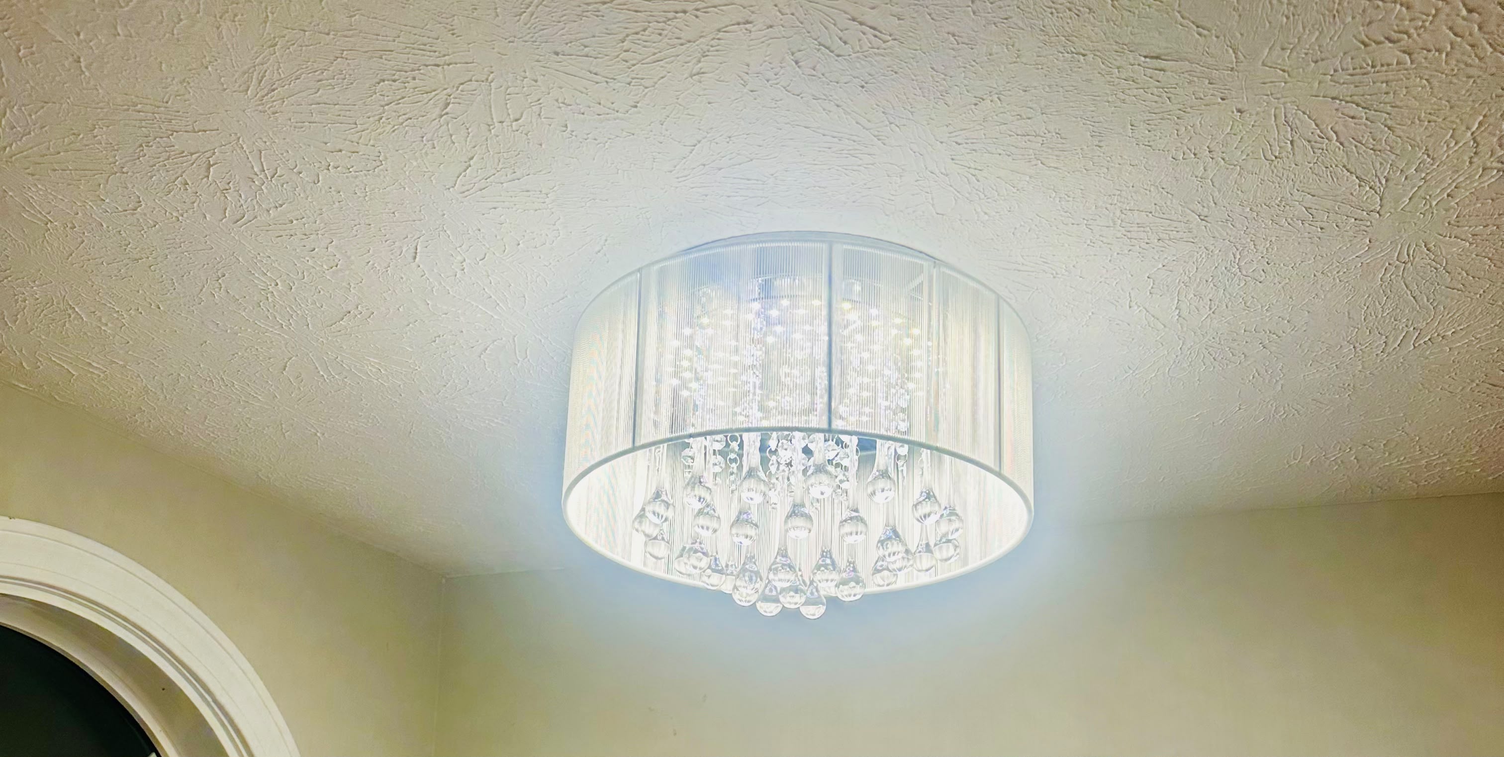 Luxury crystal drum chandelier ceiling light fixture installation by Anaeli GM Electric LLC