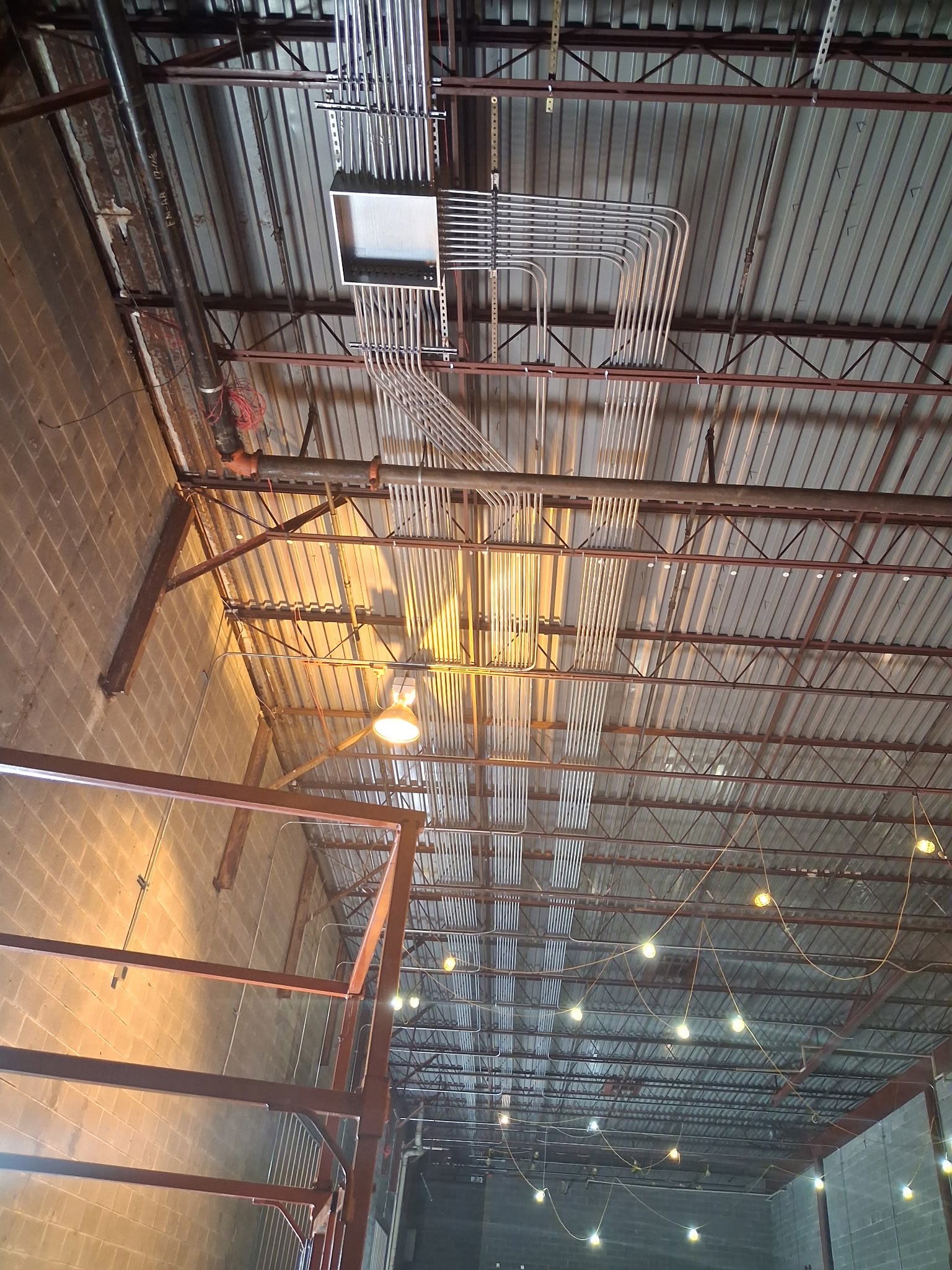Commercial industrial EMT conduit run and high-bay lighting installation by Anaeli GM Electric LLC