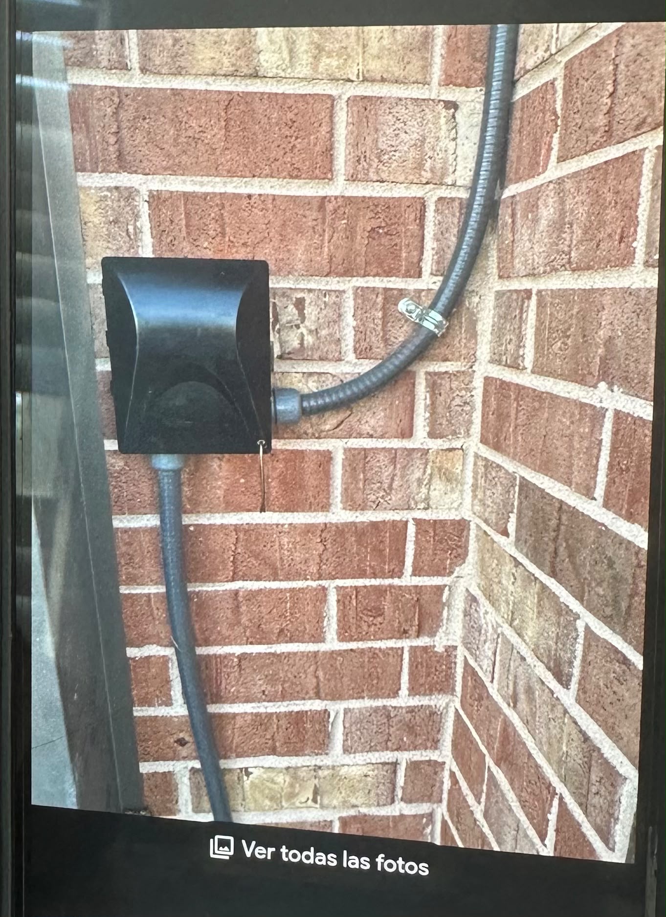Outdoor weatherproof in-use outlet box and conduit installation on exterior brick wall by Anaeli GM Electric LLC