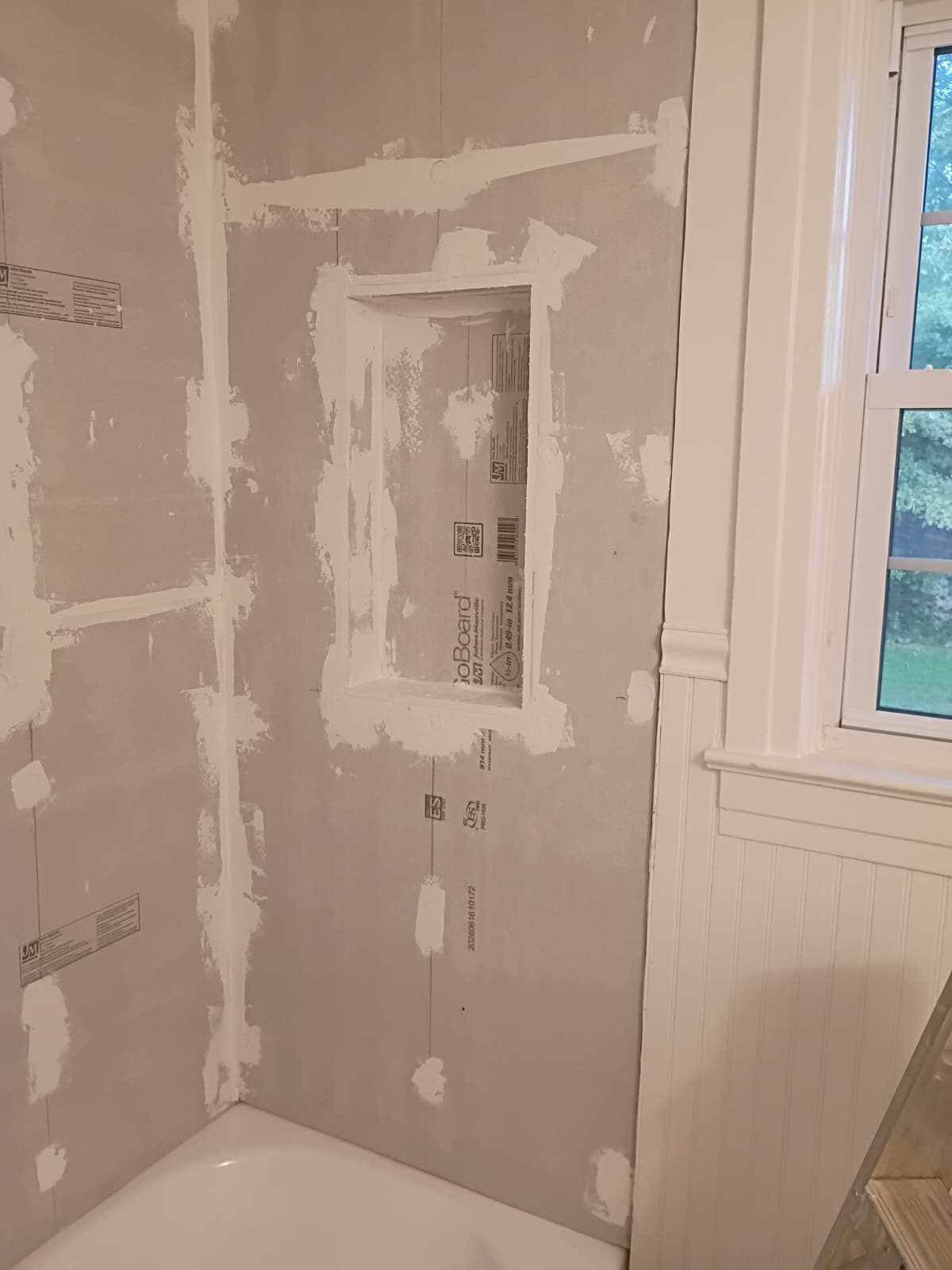 GoBoard waterproof shower backer board installation with sealed seams and custom framed niche by Roberto Vicente in Anderson SC