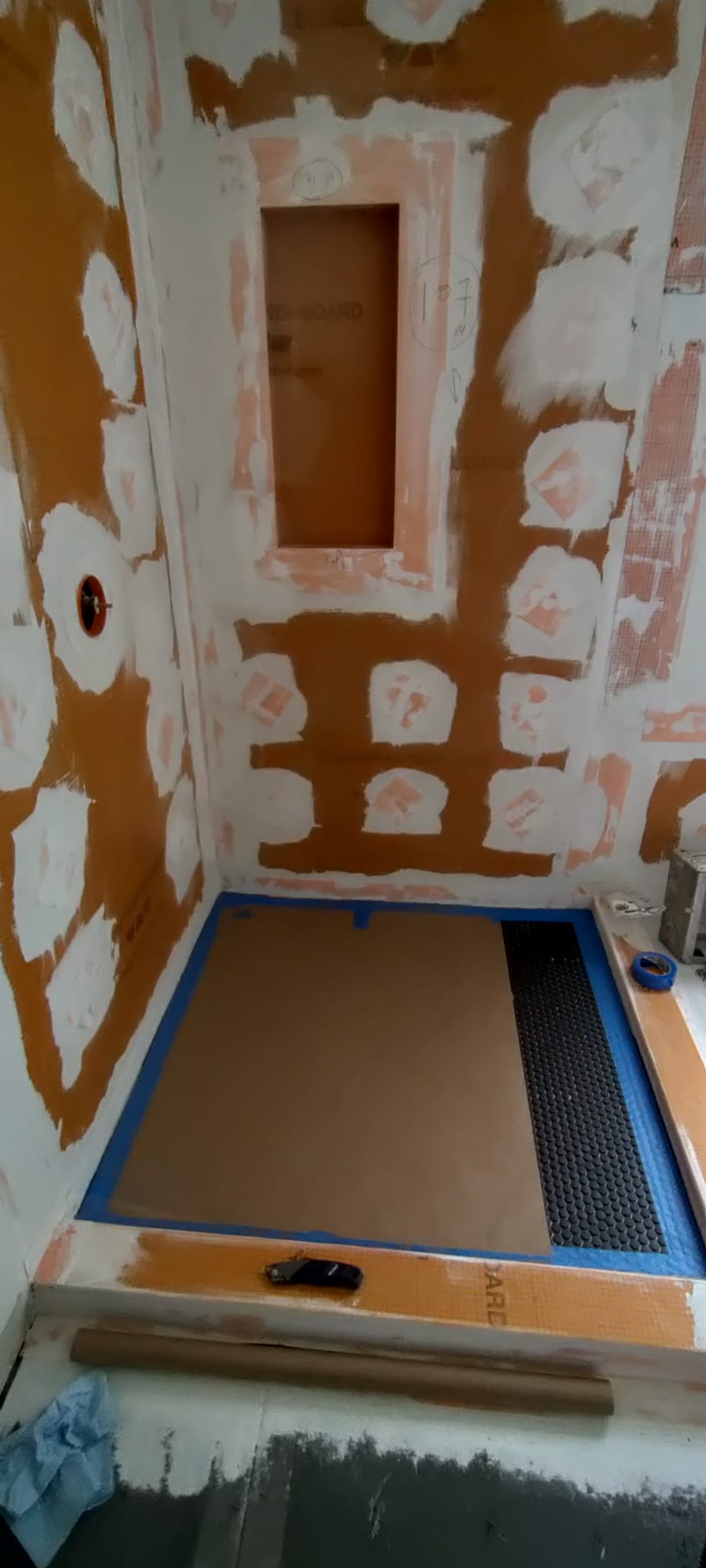 Schluter waterproof shower substrate with sealed fastener joints and custom niche by Rvicente Remodeling LLC in Clemson SC