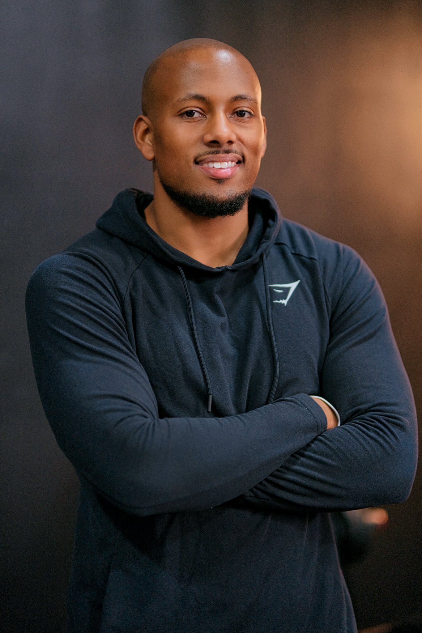 Tyler Eckles, founder of N:OW Performance Group, reviewing a client's training program