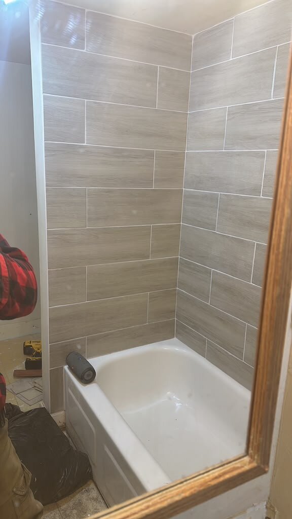 Bathroom with new tile and bathtub