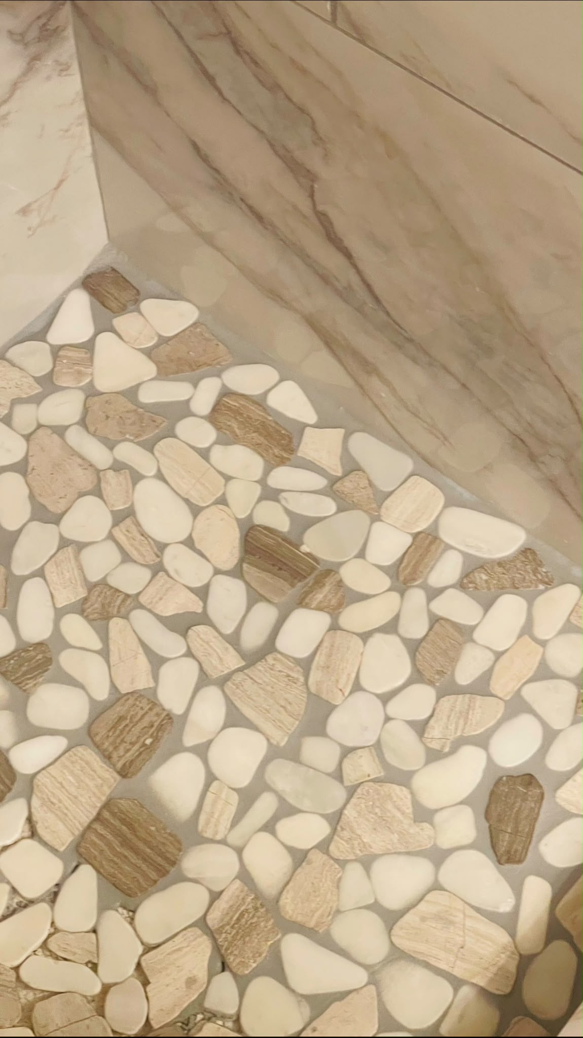 Custom river pebble walk-in shower floor remodel