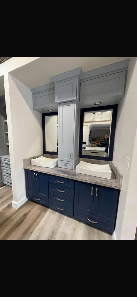 Custom navy and slate blue double vanity with center tower cabinet and dual vessel sinks by Custom Cabinets San Diego in Chula Vista CA