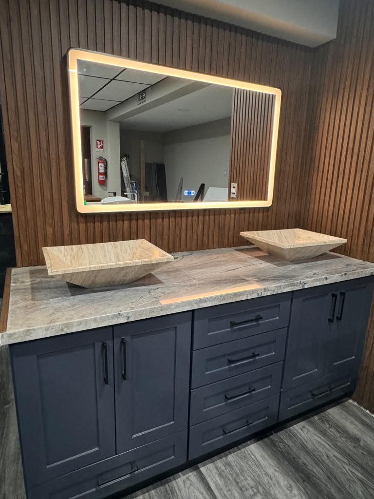 Fluted wood slat accent wall with backlit LED mirror and custom dual vanity by Custom Cabinets San Diego in Coronado CA