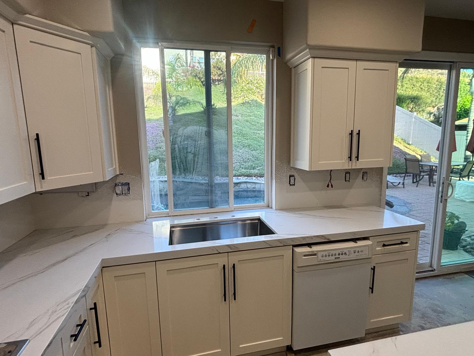 Custom off-white shaker kitchen cabinets, undermount sink, and quartz countertops in Chula Vista CA