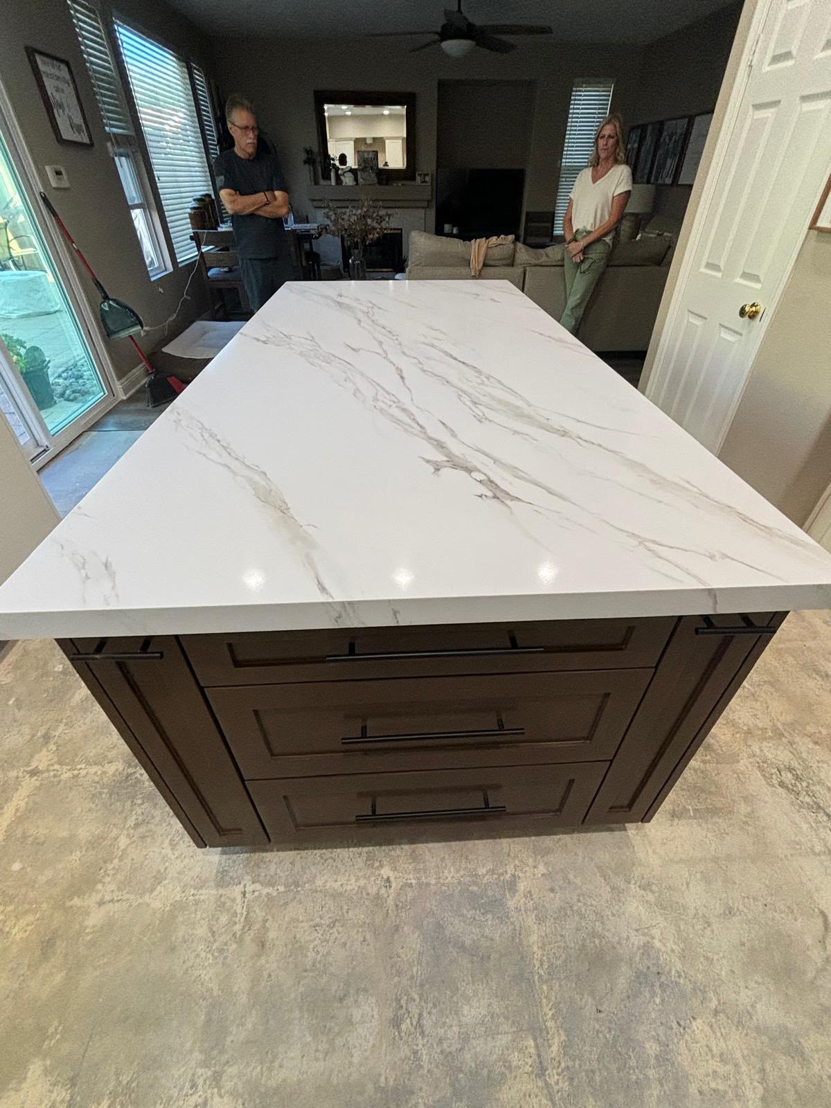 Handcrafted deep brown kitchen island with calacatta quartz countertop by Custom Cabinets San Diego in Eastlake CA
