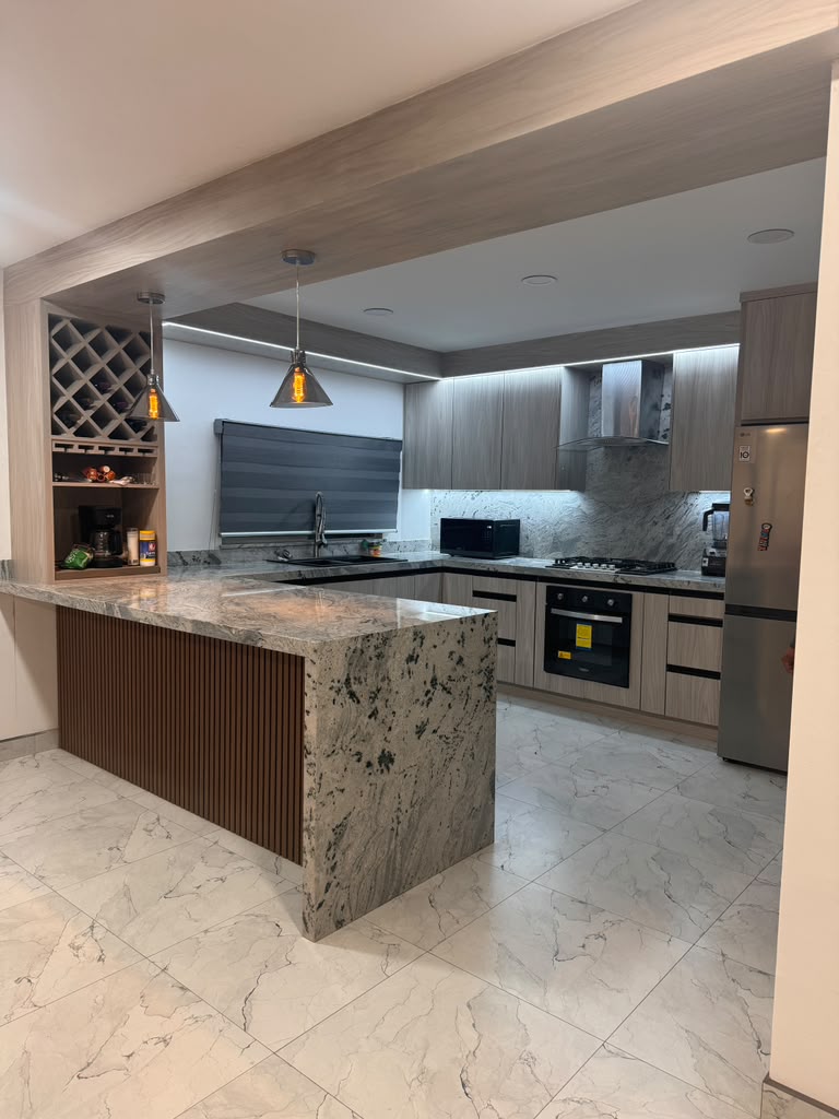 Modern custom kitchen cabinets with slatted waterfall island and integrated wine rack by Custom Cabinets San Diego