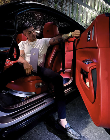 Justin Guerra inside Rolls-Royce with red leather interior and starlight ceiling