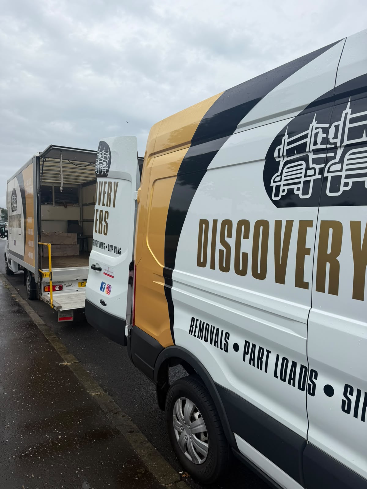 Discovery Movers van parked with doors open on a residential street for a Fife move
