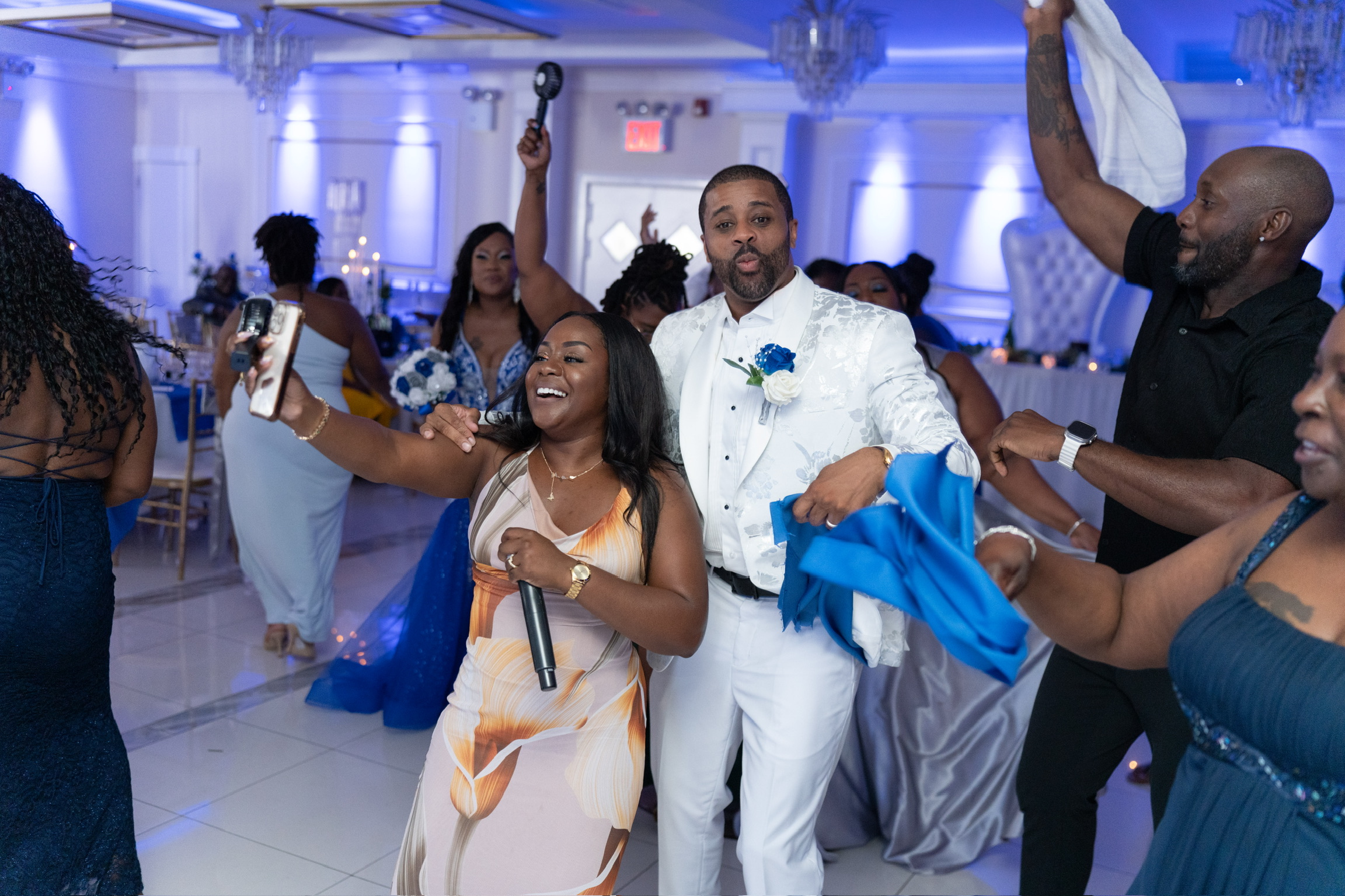 Taje hosting and celebrating on the dance floor with guests