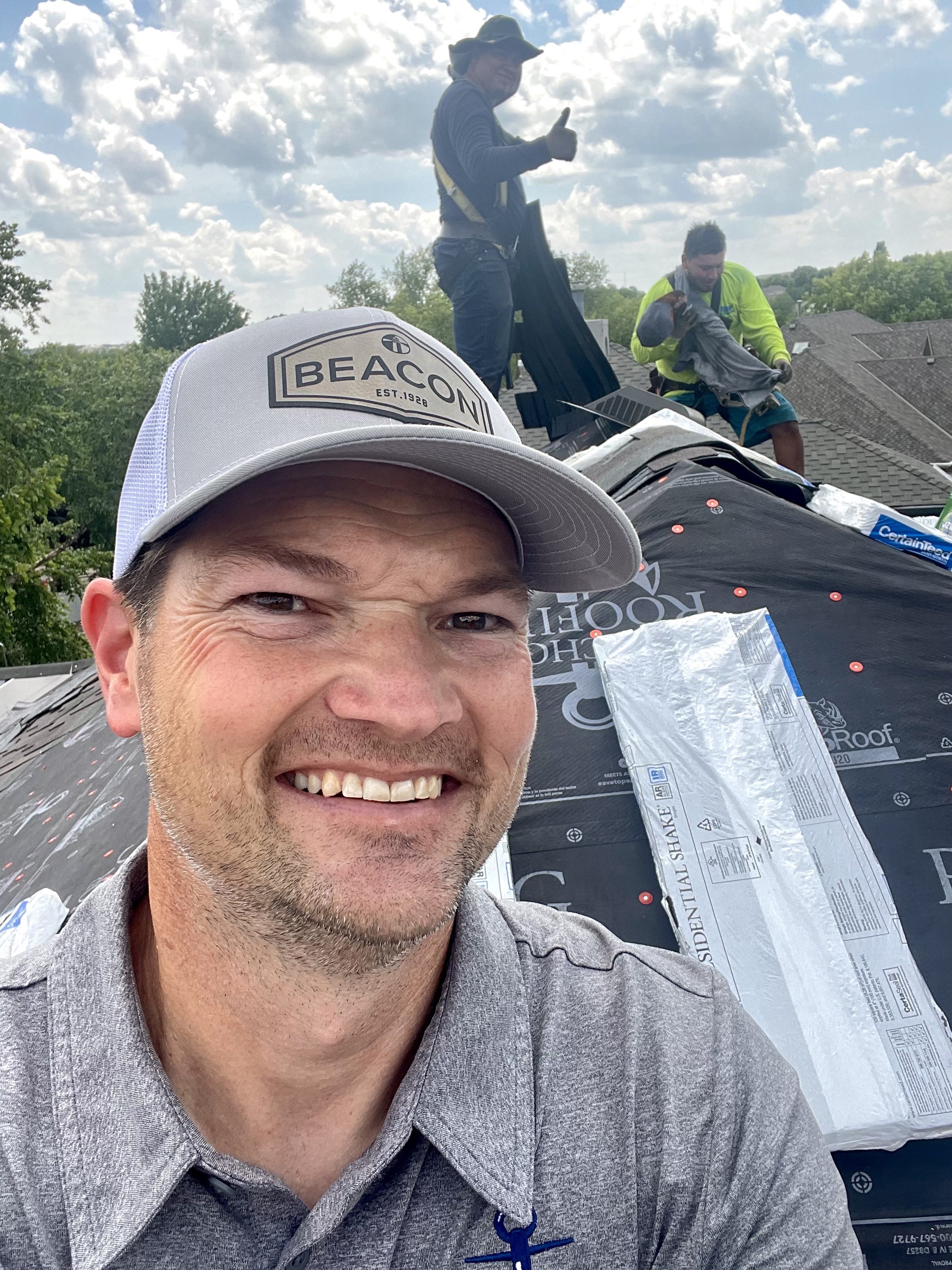 Bryan Hickam reviewing roofing installation on site in Omaha