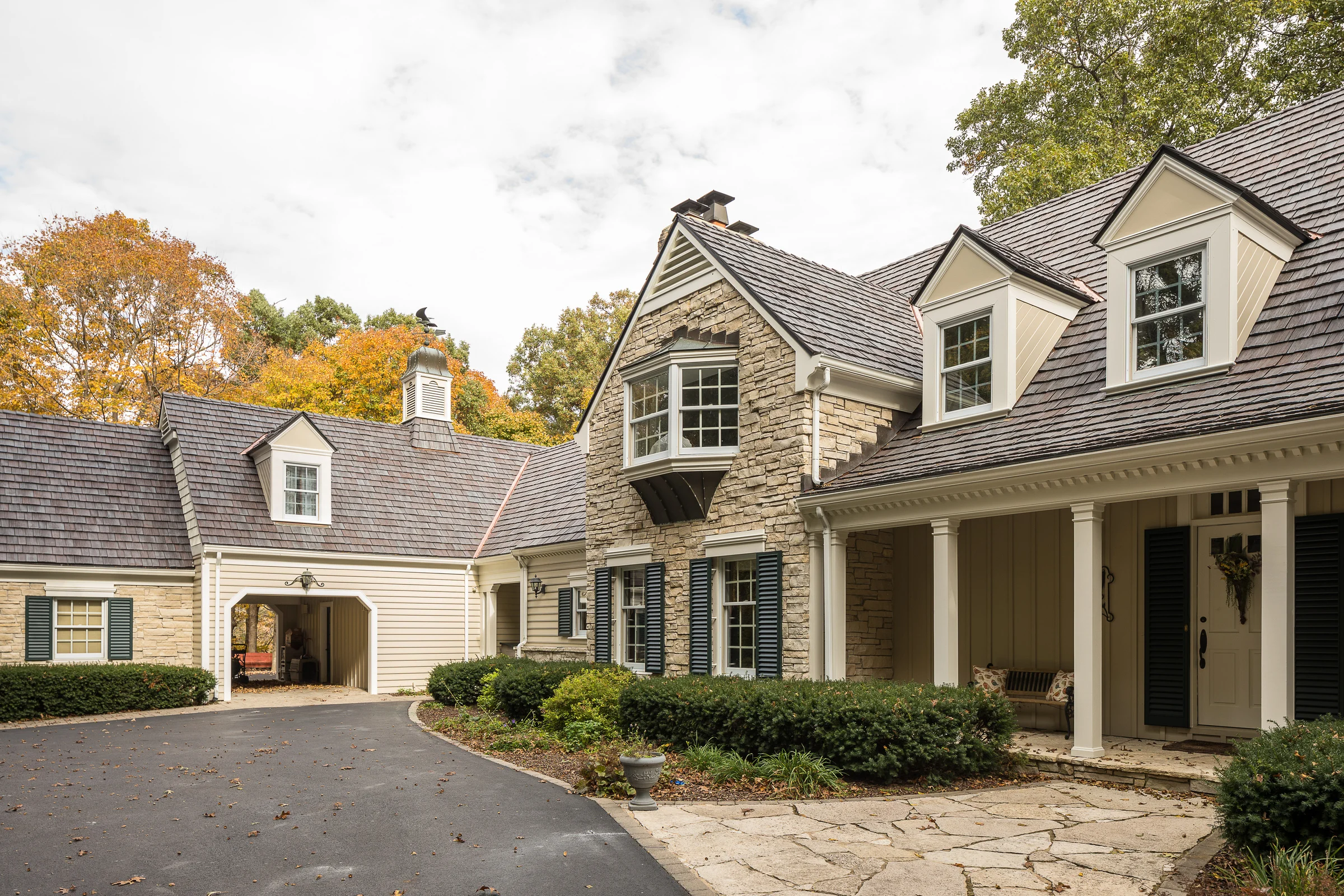 Architectural residential roof installation on an Omaha-area stone estate home