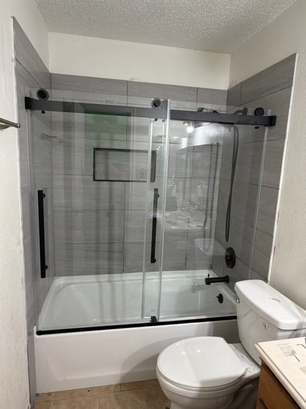 Glass Sliding Shower Door & Tile Surround — Flooring & Tile project by Manny