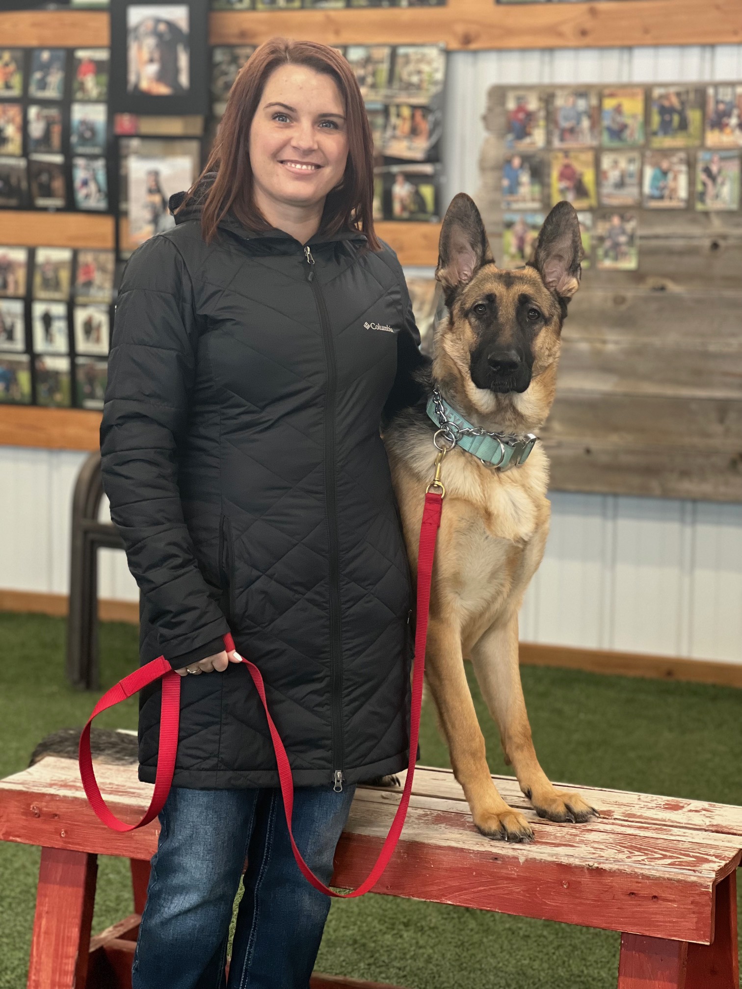 Owner smiling with German Shepherd on bench