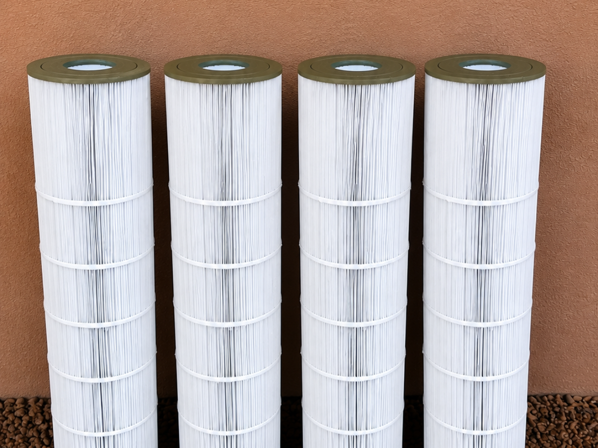 Clean replacement pool cartridge filters lined up after maintenance