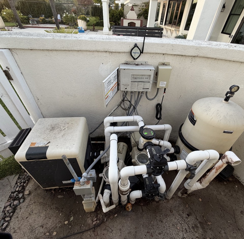 Pool equipment pad with automated Pentair EasyTouch controls, pump, filter, and heater