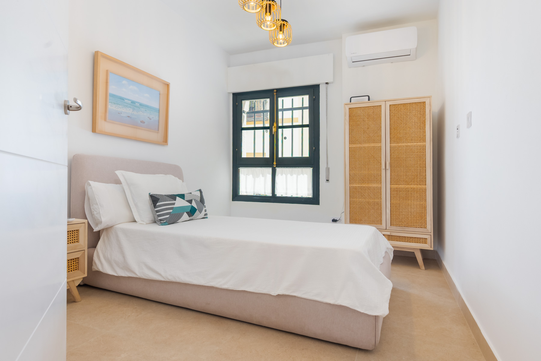 Bright Bedroom with Woven Wardrobe & Window