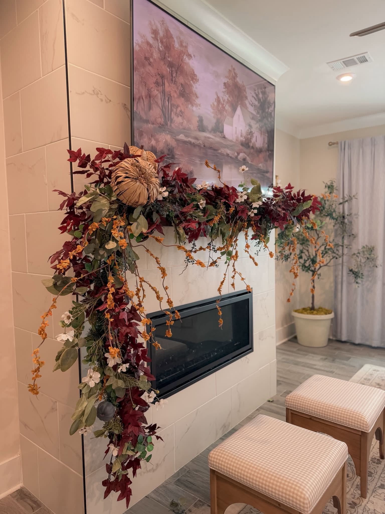 Custom fall floral garland styling with textured pumpkins across a modern fireplace mantel