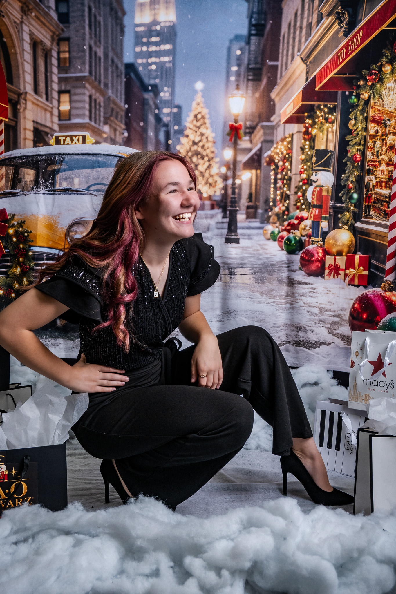 Northview Choir student posing with festive New York Christmas backdrop and holiday gifts