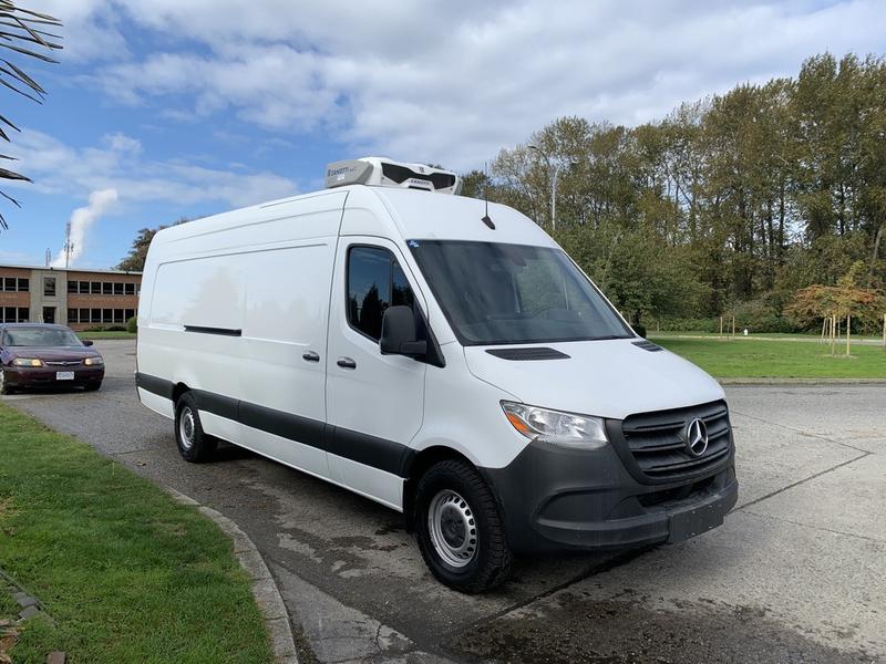 Saints Haul & Removal Krew white high roof Sprinter van on site