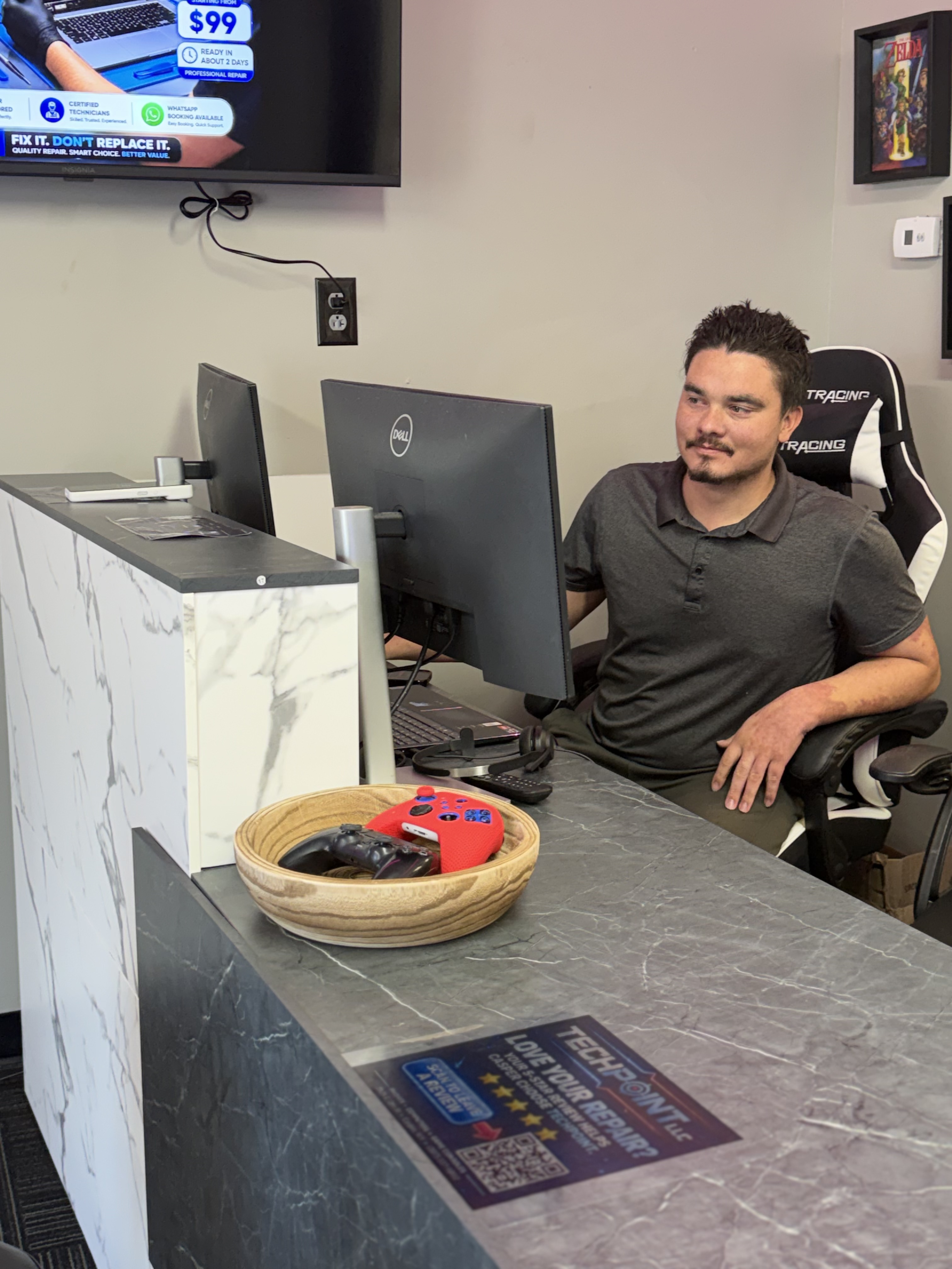 TechPoint certified technician assisting customer at Casper, WY repair desk