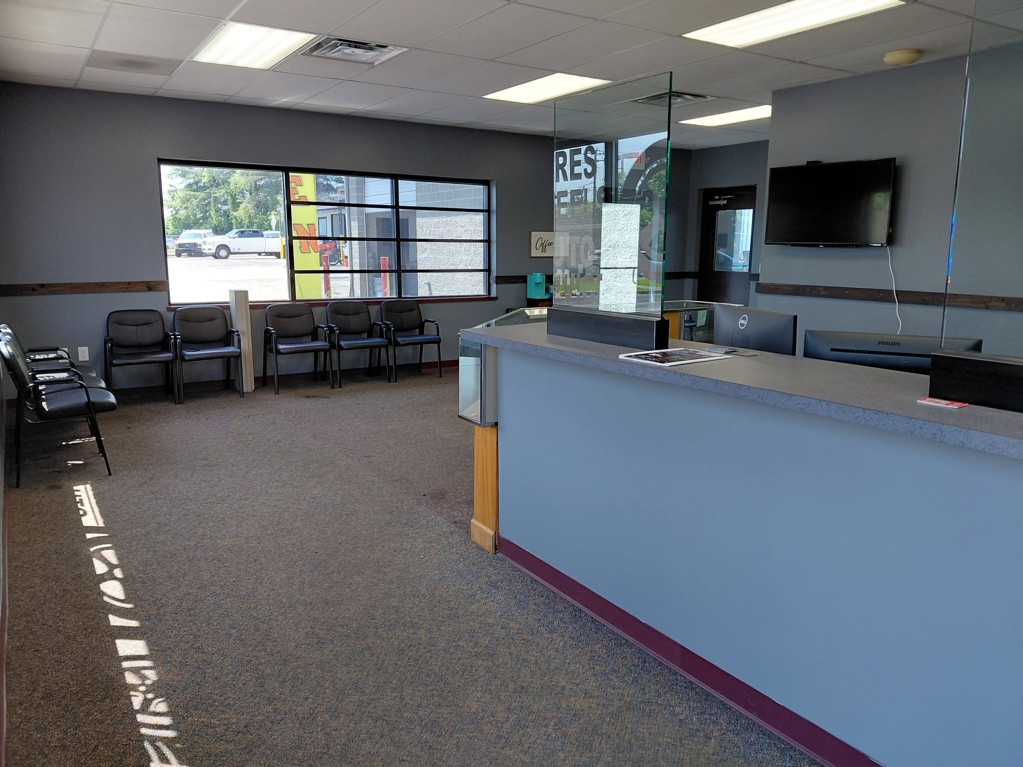 Clean, comfortable customer reception and waiting area at Revived Automotive in Walton, KY