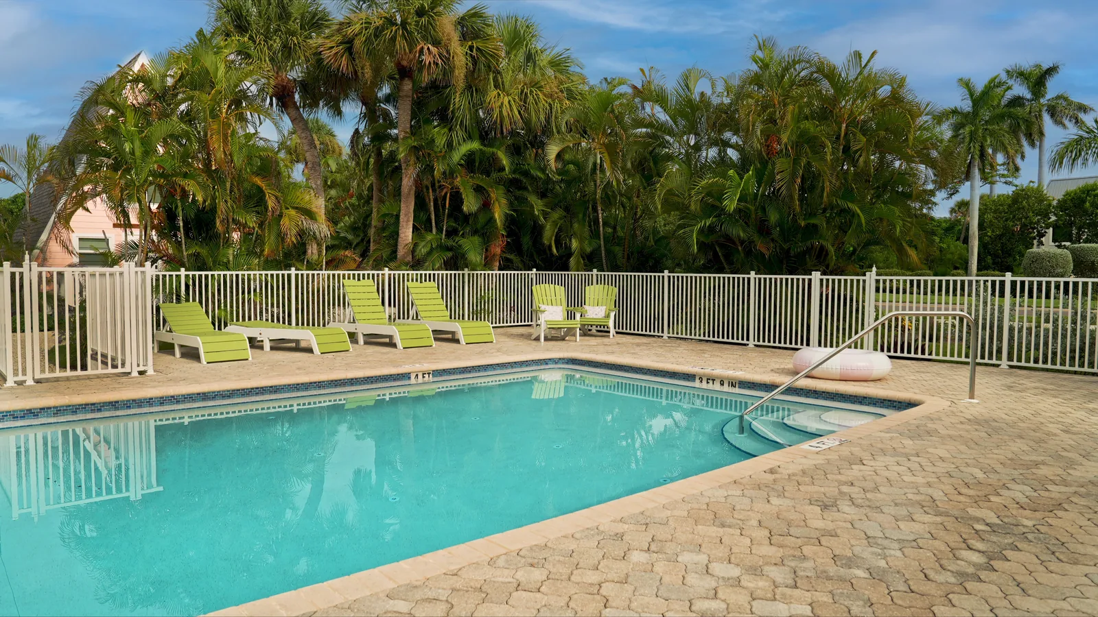 Resort style swimming pool with clean deck and clear water