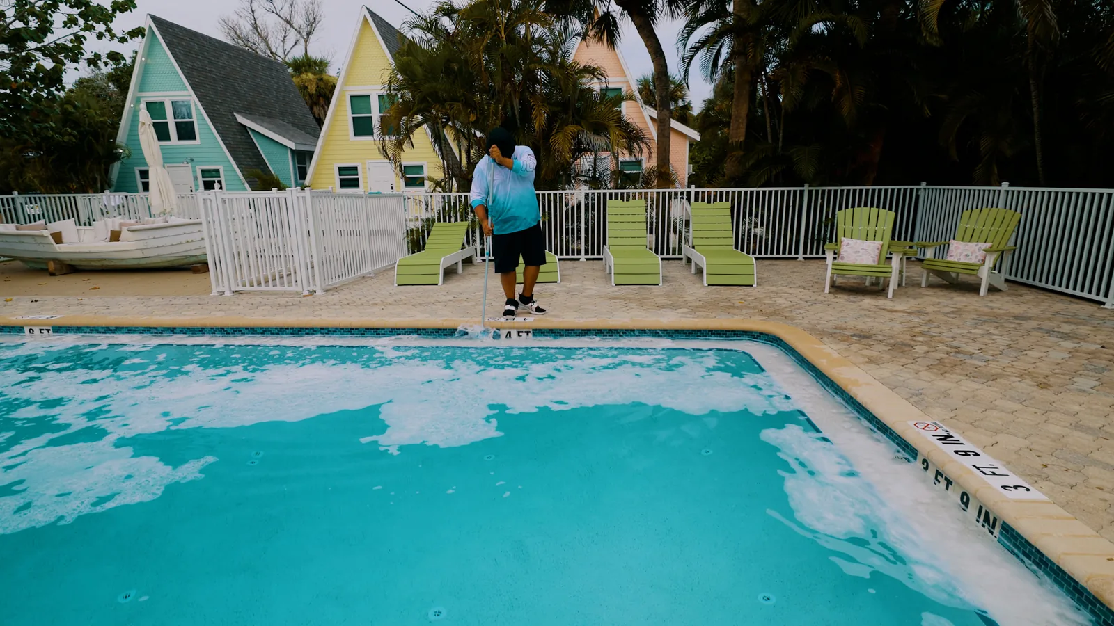 Clear blue swimming pool with tidy tile line and balanced water